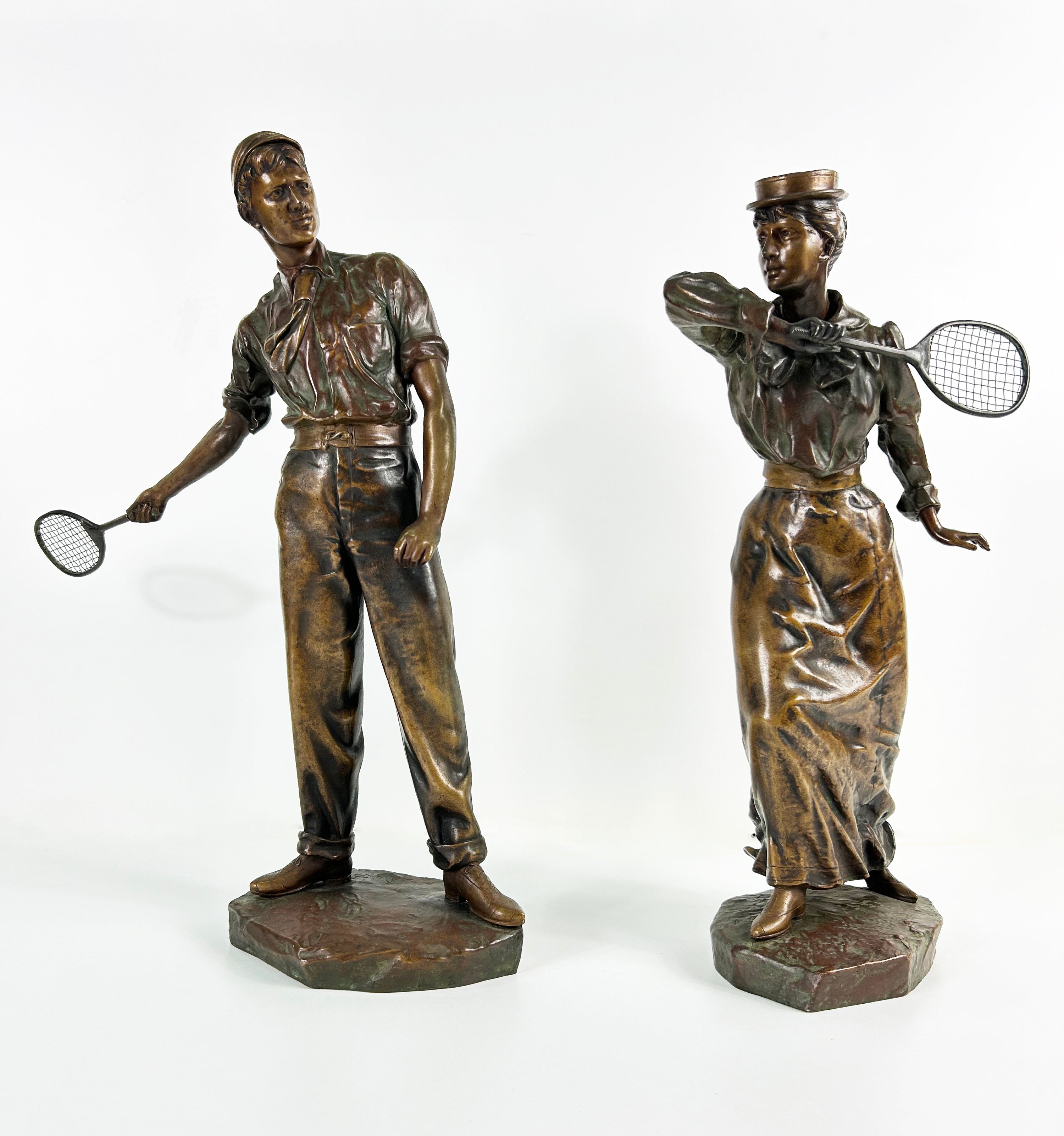 ANTIQUE TENNIS PLAYER COUPLE SCULPTURES